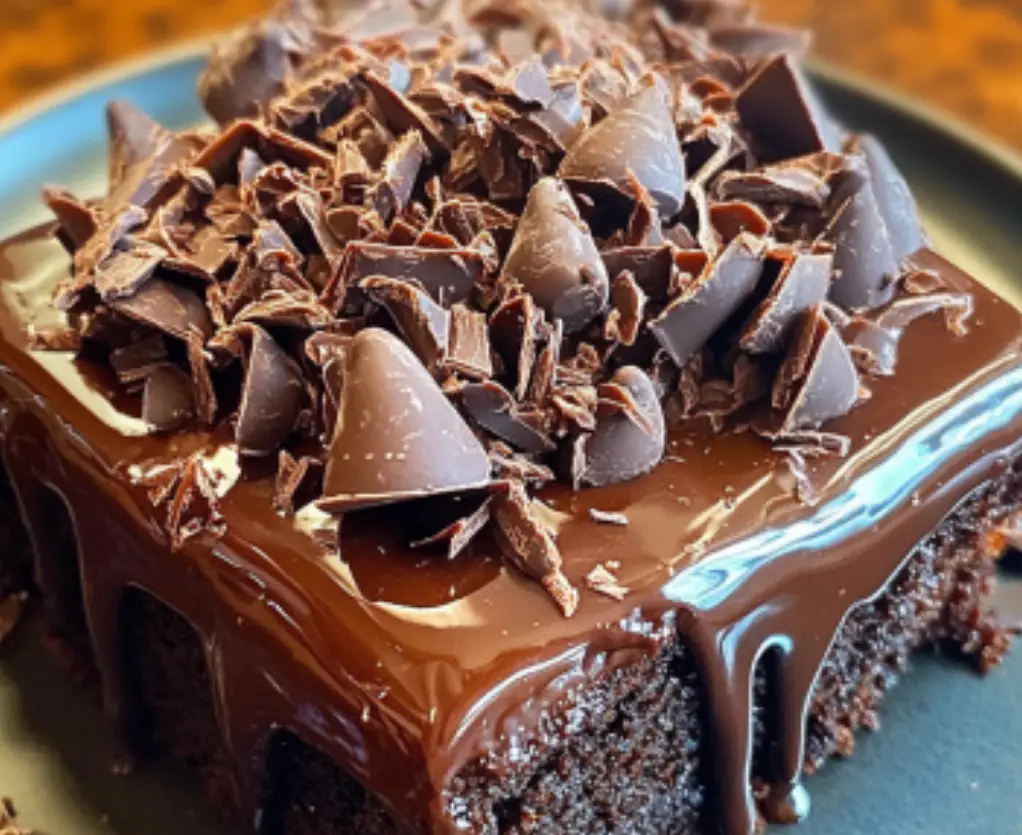 Decadent Chocolate Poke Cake with Ganache and Shavings
